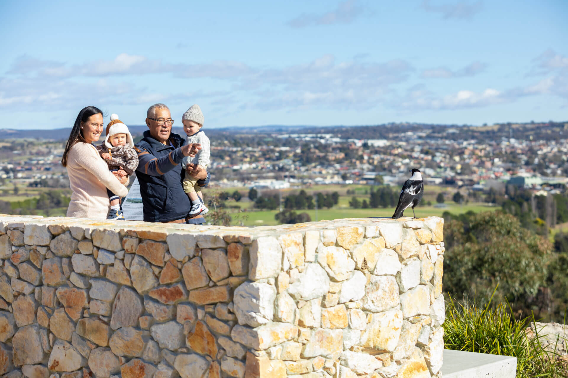 Father and daughter and two baby boys looking over Goulburn from Rocky Hill winter 2021 Image by Field – Film